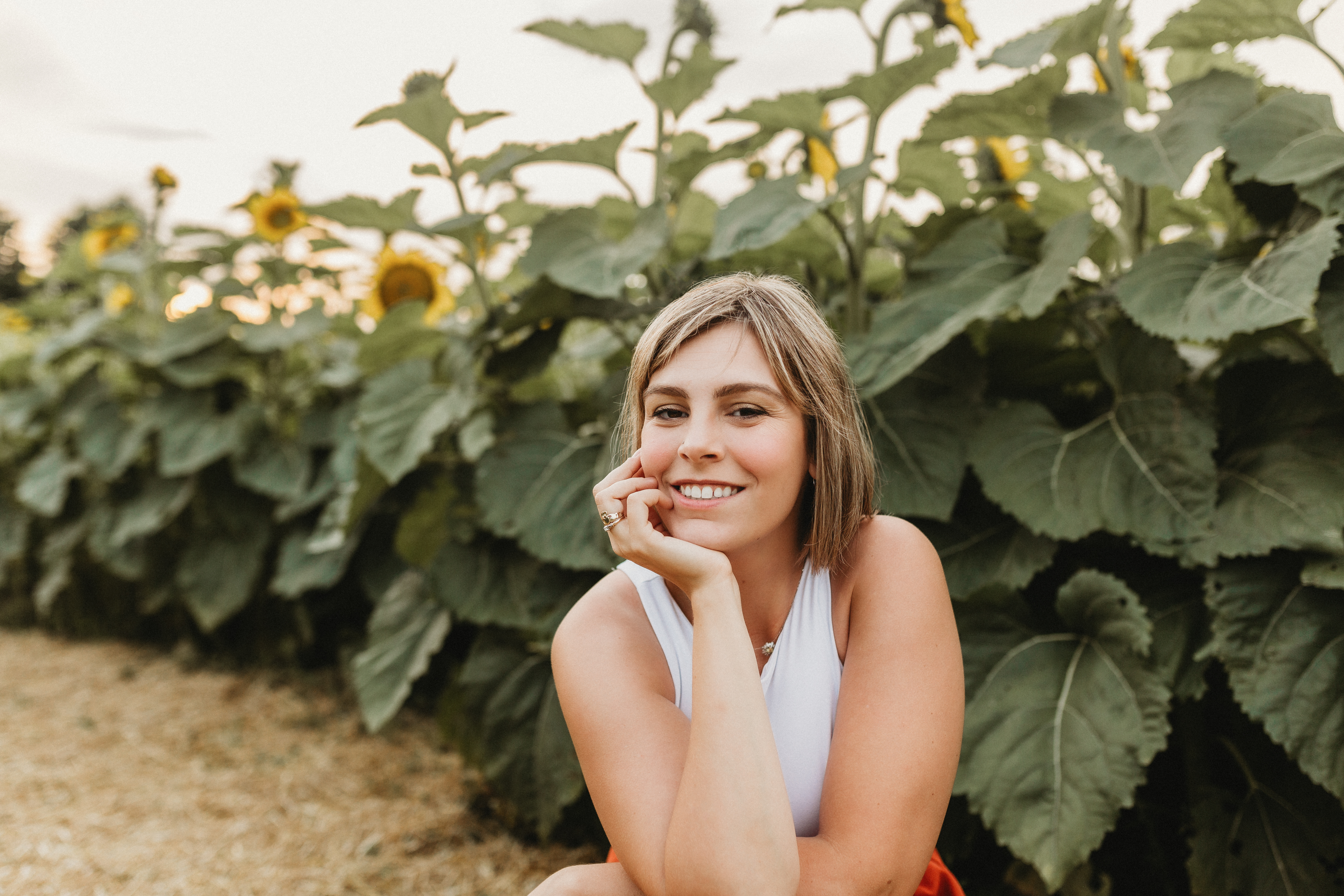 Guest relaxing among the sunflowers at EkkoFarm organic farm near Valencia