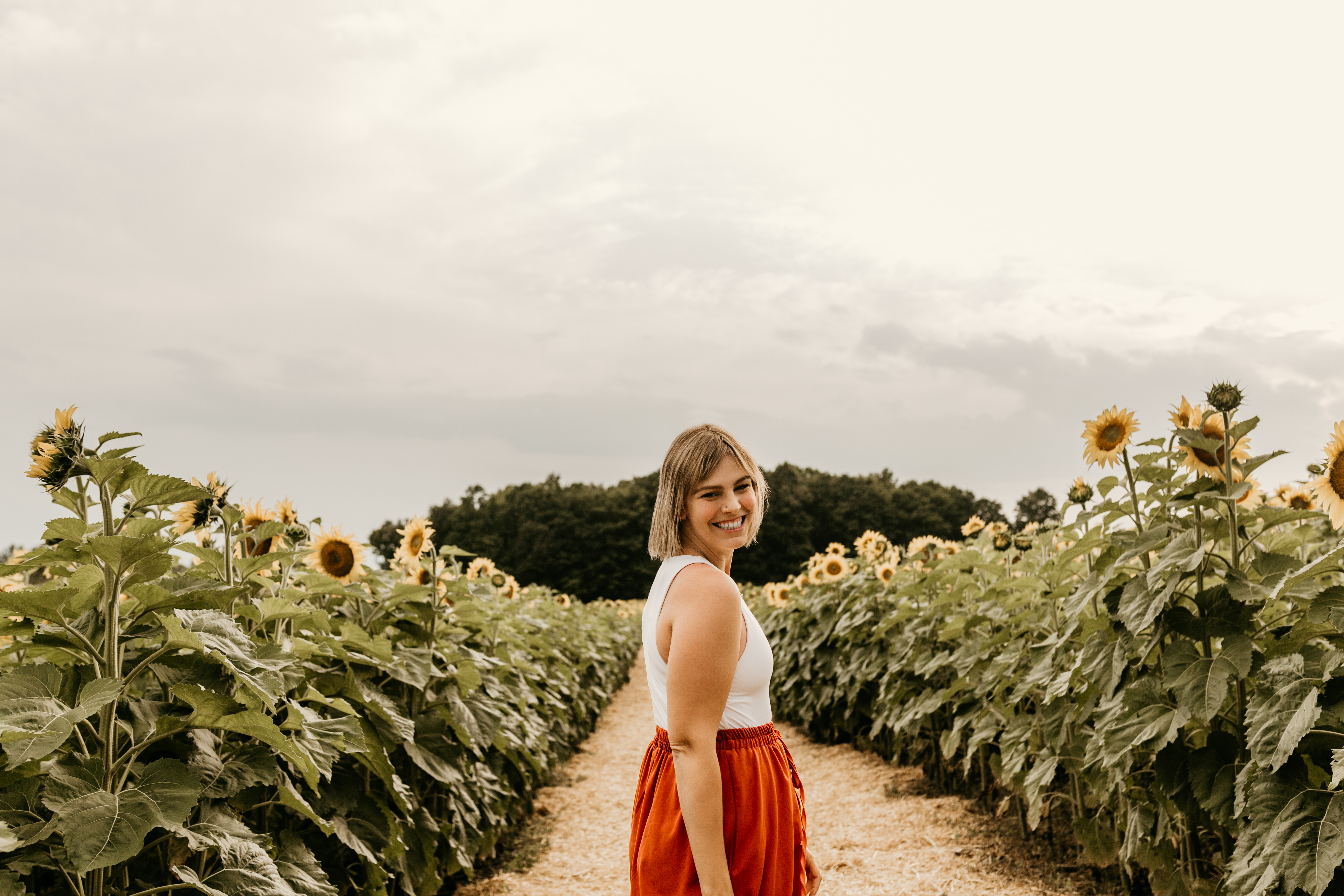 Guest exploring the sunflower trails at EkkoFarm organic farm in Bétera, Valencia